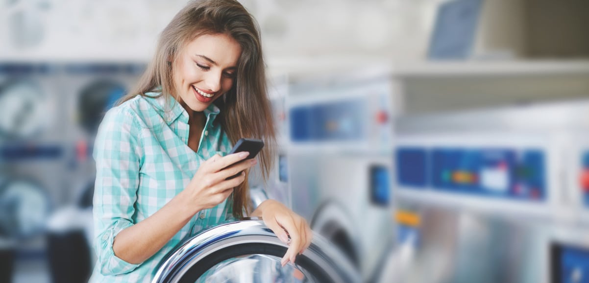 person at laundromat